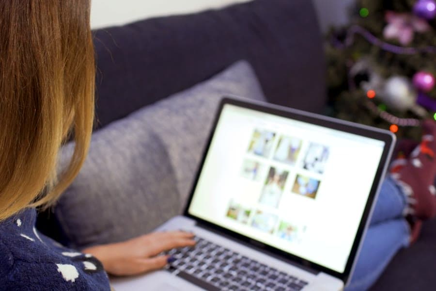 Illustrative stock photograph of a person working on a laptop at home